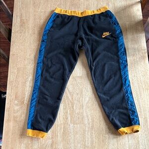 Nike Black Joggers with Blue and Gold Accents